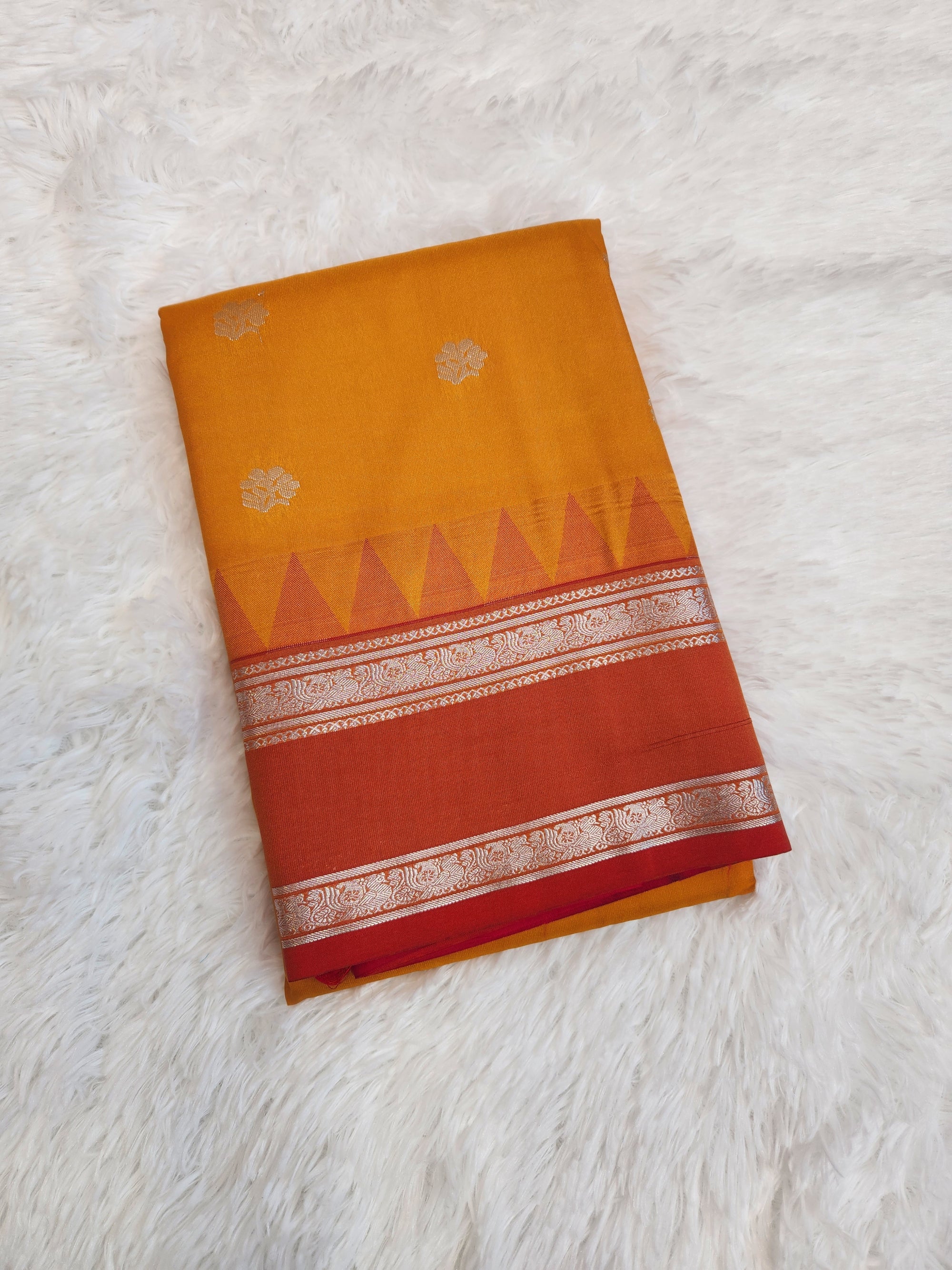 Saffron Yellow Semi Kanchi Saree with Silver Zari & Orange Pallu Design