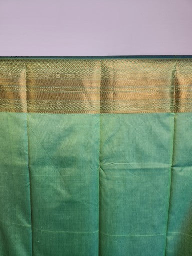 Emerald Green Semi Kaanchi Saree with Copper Zari & Small Butta Design