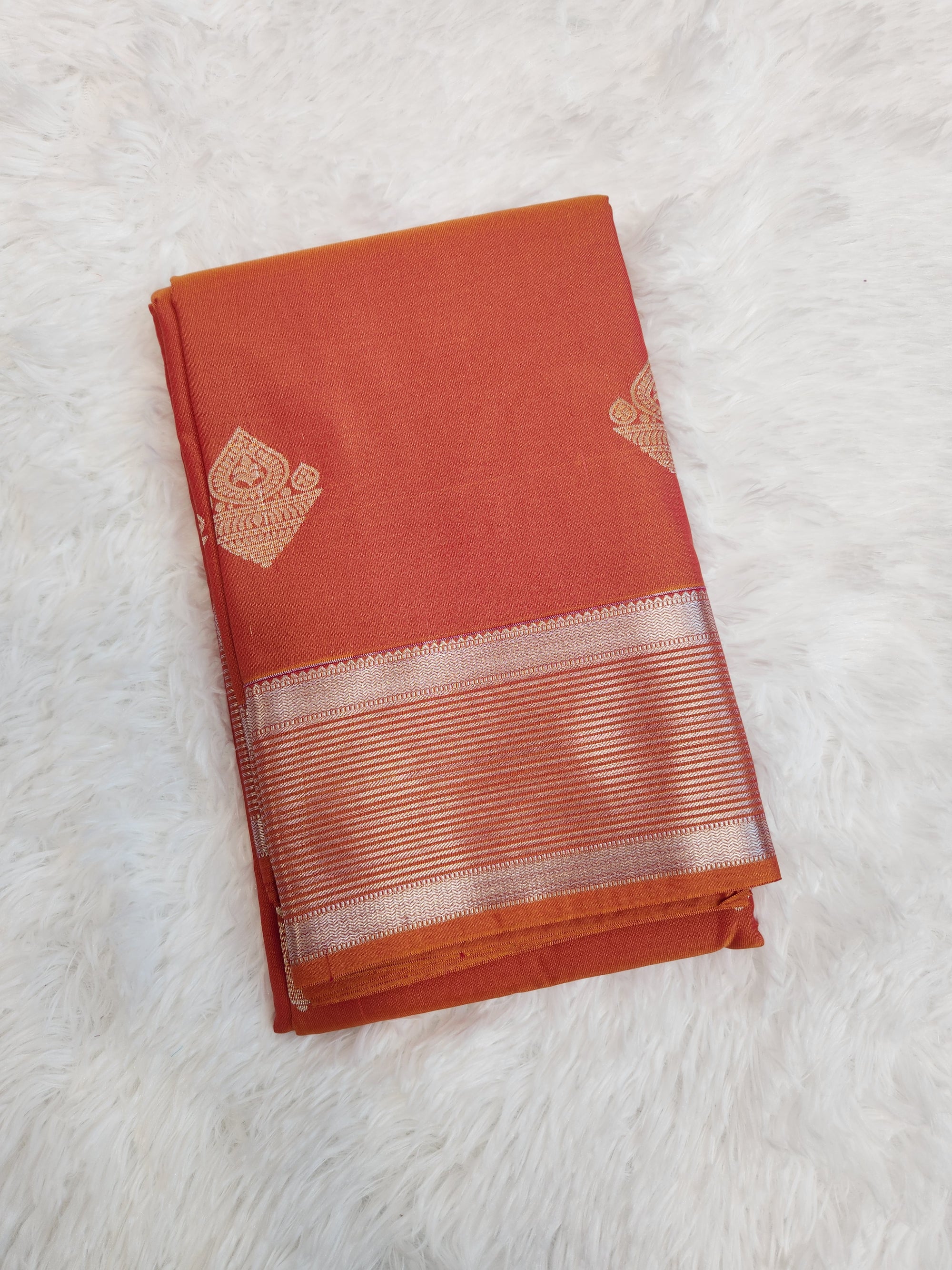 Rust Orange Semi Kanchi Saree with Silver Zari & Flower Butta Design