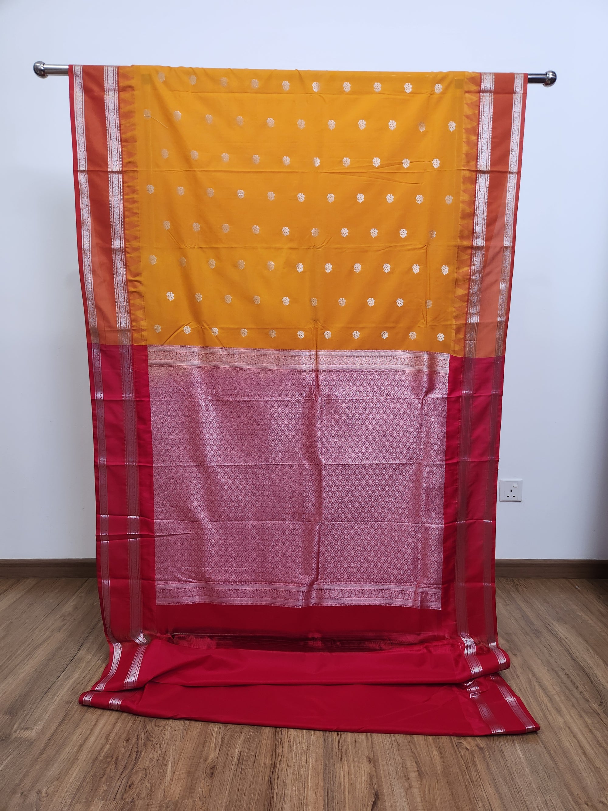 Saffron Yellow Semi Kanchi Saree with Silver Zari & Orange Pallu Design